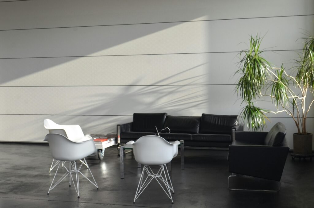 Stylish minimalist living room with modern furniture and natural light in Berlin, Germany.